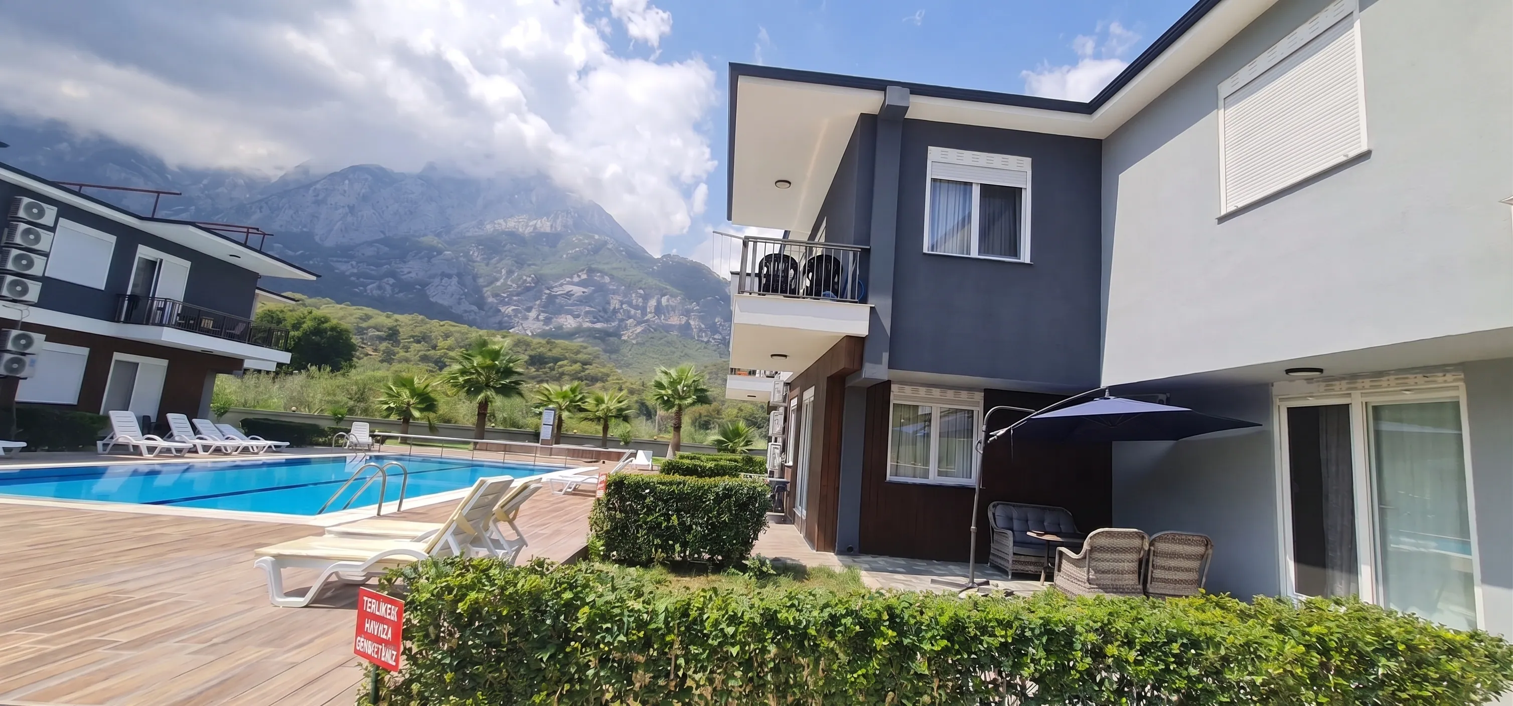 Pool and garden area with mountain backdrop - Kemer vacation rental